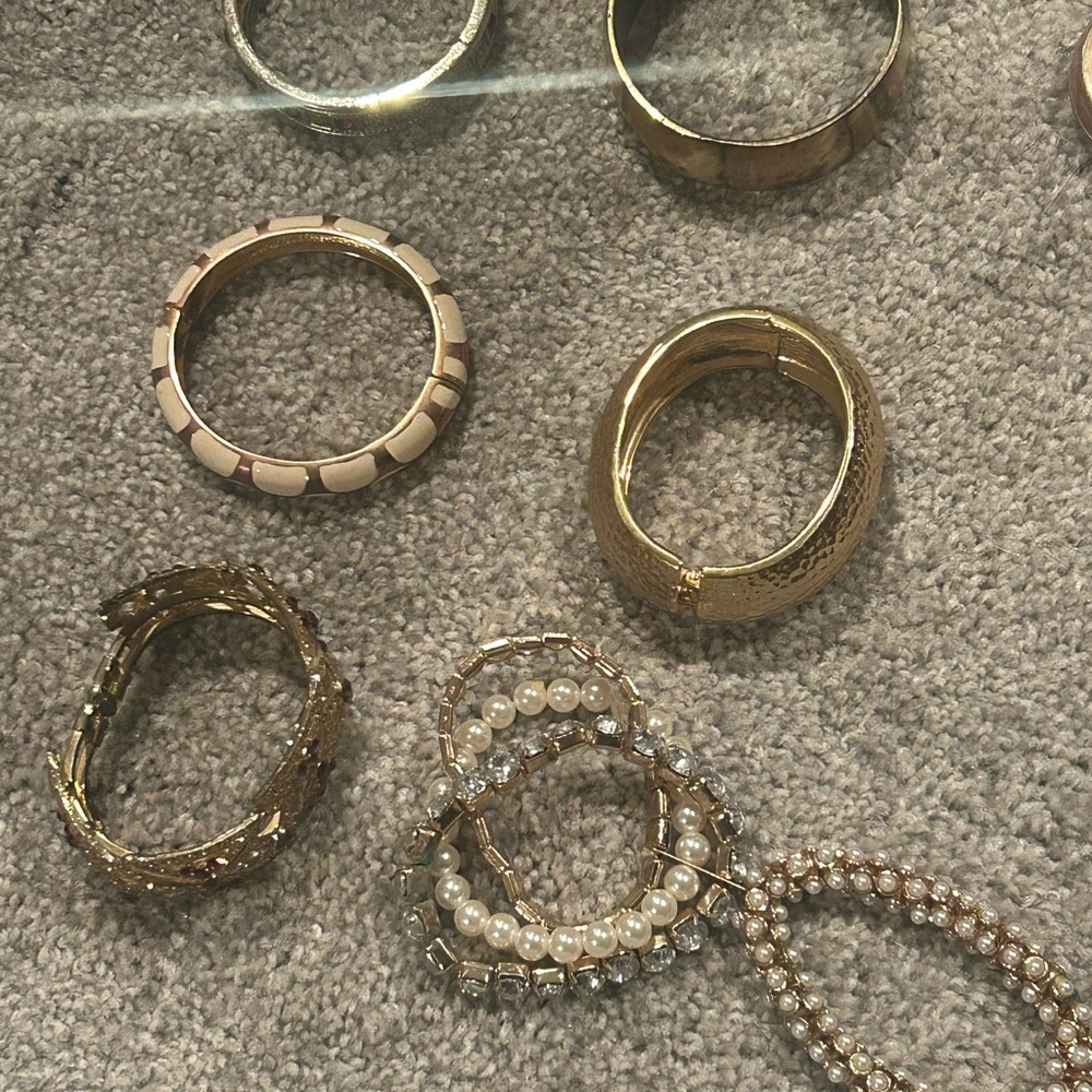 Gold Bracelets with Textured Designs and Hand Purse